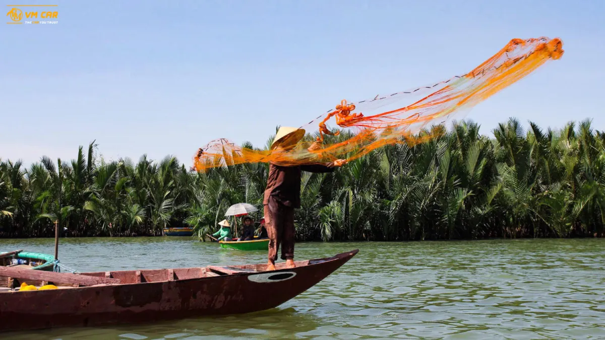 Bay Mau Coconut Forest Hoi An: Things To Do & Travel Tips 5 A fisherman demonstrates how to cast a net to catch fish