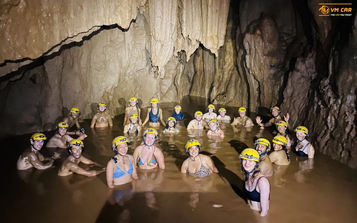 Mud bathing at Dark Cave