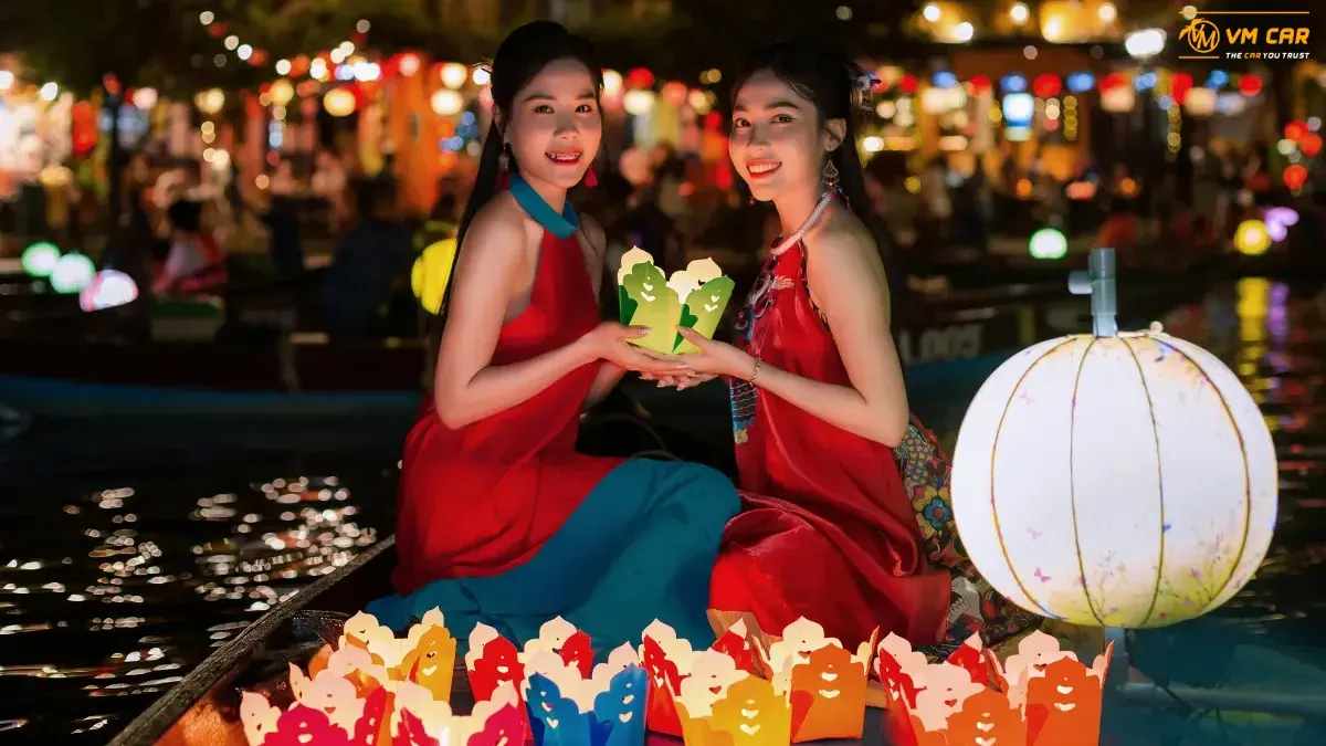 Boating and releasing flower lanterns on the Hoai River